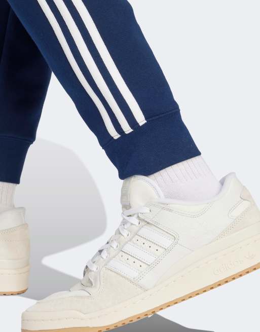 adidas Originals 3 stripes track pants in navy | ASOS