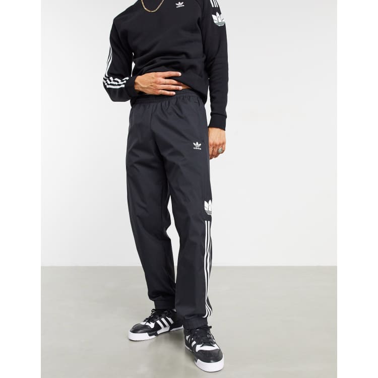 adidas Originals 3D trefoil three stripe joggers in black