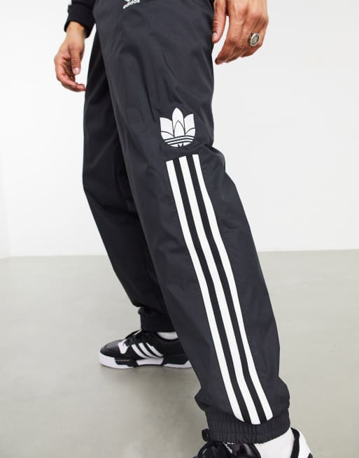 adidas Originals 3D trefoil three stripe joggers in black ASOS