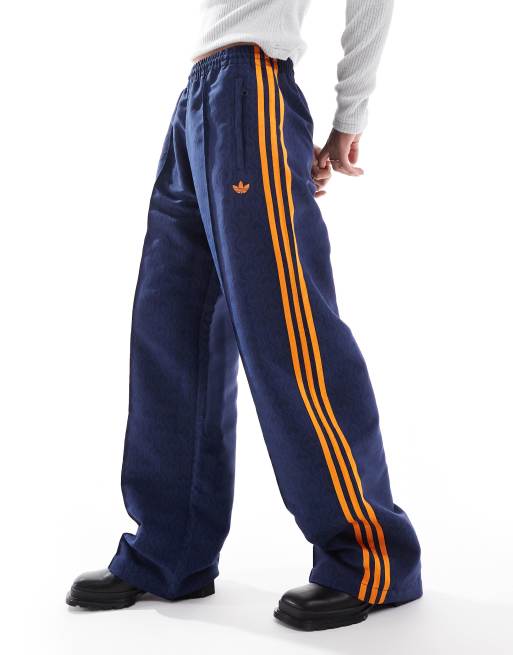 adidas Originals 70s oversized monogram track pant in blue