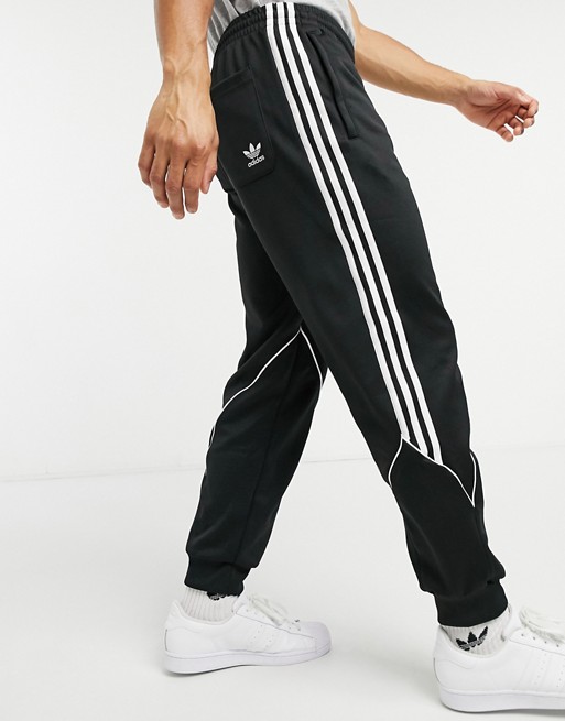 adidas Originals abstract trefoil track joggers in black