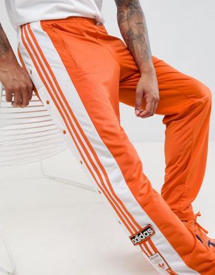 adibreak track pants orange