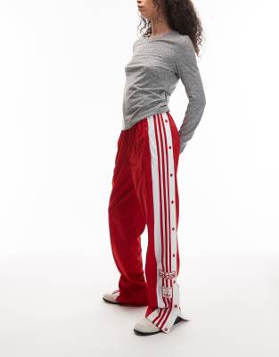 adidas Originals - Adibreak - Trainingshose in Rot und Weiß