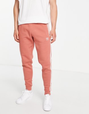 adidas Originals adidas Originals Adicolor 3 stripe slim trefoil joggers in orange