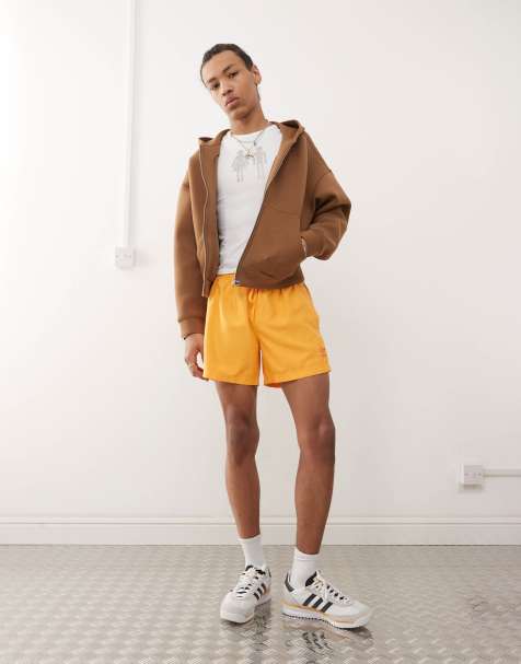adidas Originals Adicolor 3-Stripes 5-Inch Swim Shorts in gold - view 1