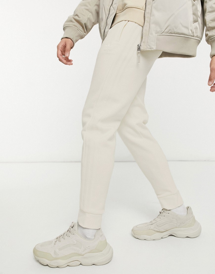 Adidas Originals adicolor 3-Stripes non-dyed track pants in cream-White