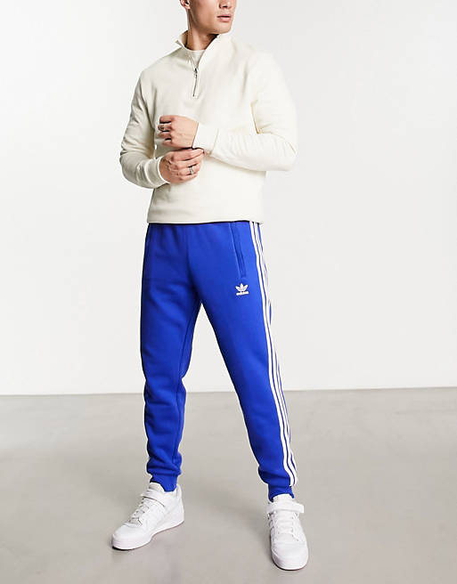 adidas Originals adicolor 3-Stripes sweatpants in blue | ASOS