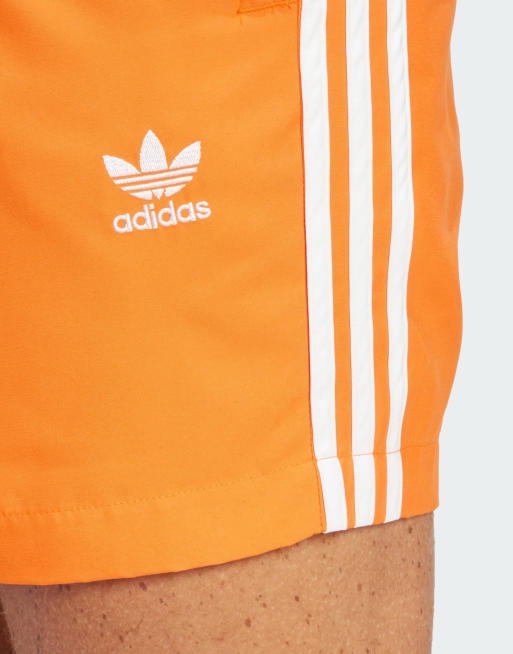 Orange adidas shorts store