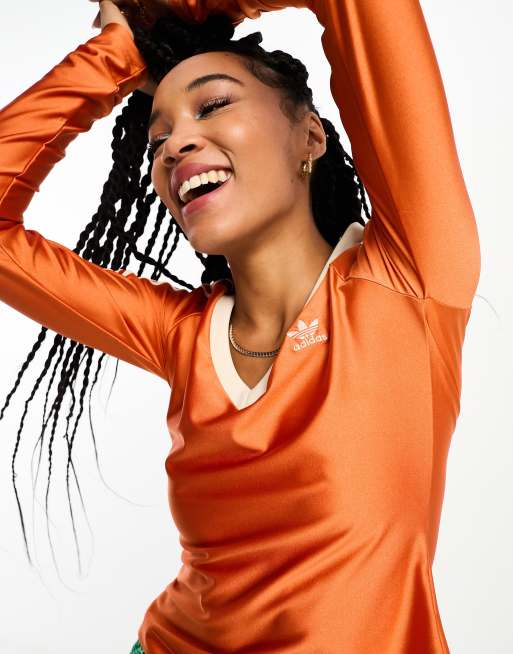 adidas Originals – adicolor 70s – Oberteil in Orange mit V-Ausschnitt 