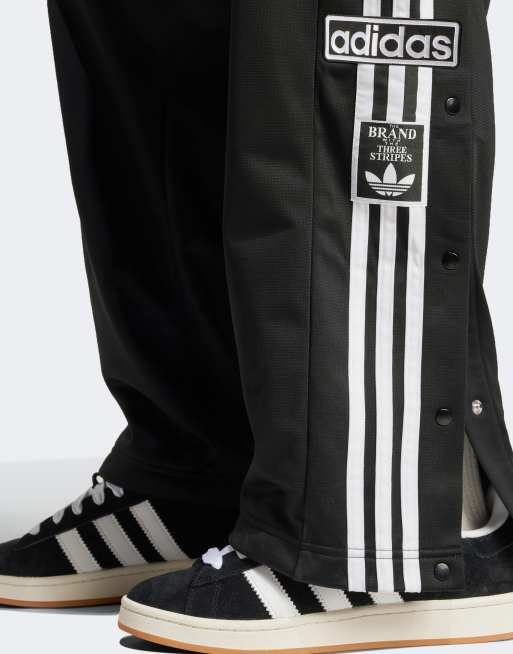 The brand with the three stripes pants on sale