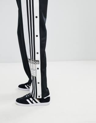 adidas originals mixed stripe popper pants in black and white