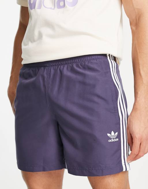 adidas Originals – adicolor – Badeshorts mit drei Streifen in Marineblau