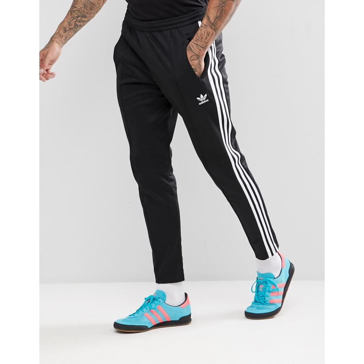 adidas Originals Adicolor Three Stripe Flared Pants In Black, $48, Asos