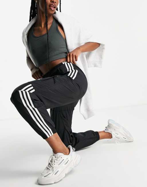 Adidas originals three stripe track pant in black deals