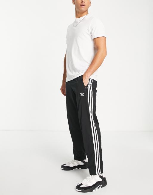 adidas Originals – adicolor – Firebird – Czarne joggersy z trzema paskami