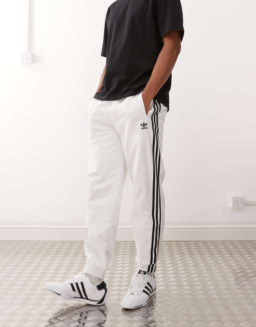 adidas Originals - Adicolor - Firebird - Geweven trainingsbroek in wit / zwart