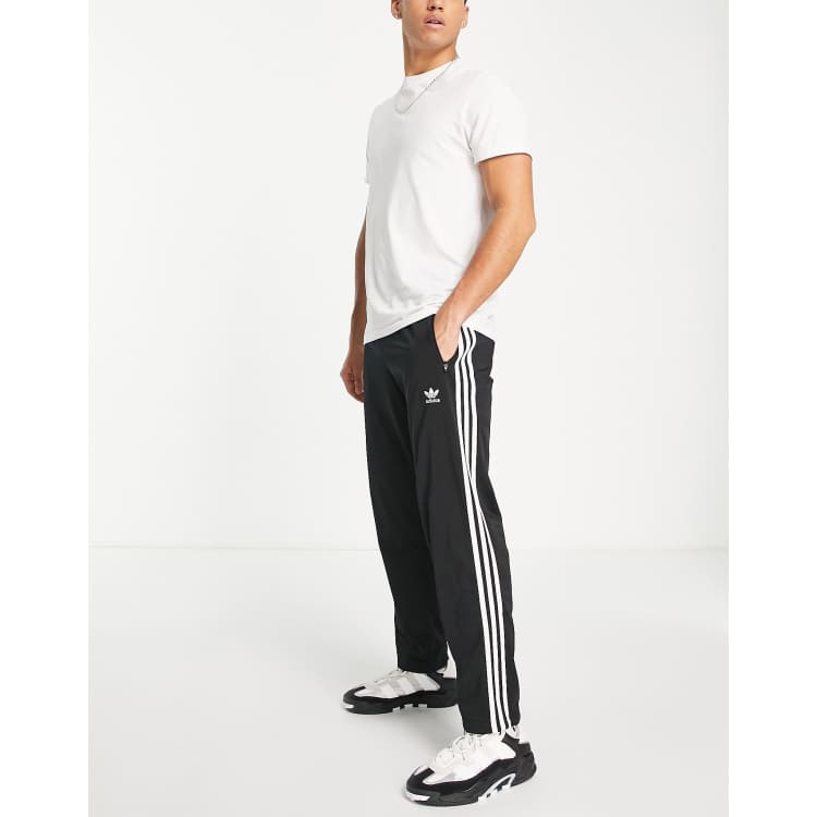 Estado Saga Normalización adidas Originals adicolor Firebird three stripe joggers in black | ASOS