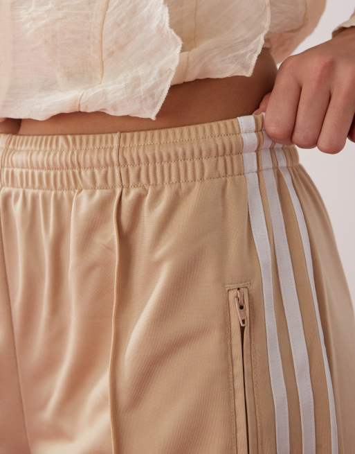 adidas Originals Adicolor Firebird track pants in beige | ASOS
