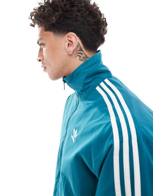 adidas Originals Adicolor Firebird track top in blue