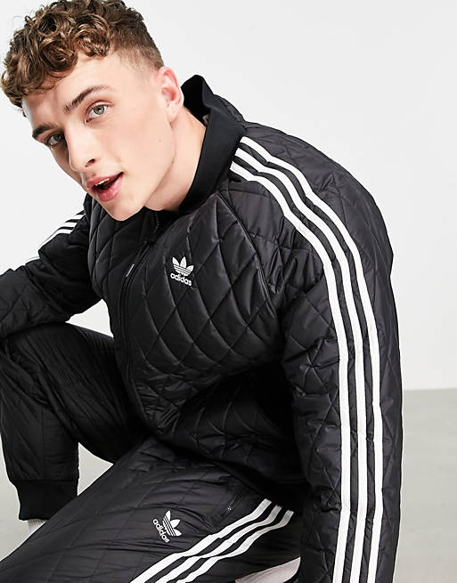 adidas Originals – adicolor – Gesteppte Trainingsjacke in Schwarz mit drei  Streifen | ASOS