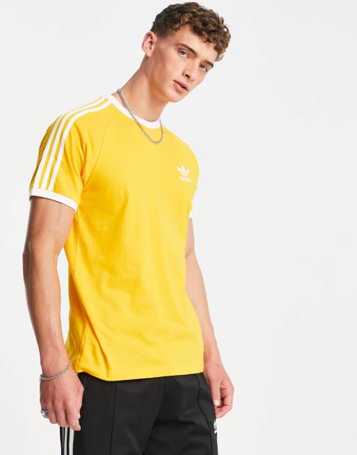 adidas Originals – Adicolor – Guldfärgad t-shirt med 3 ränder