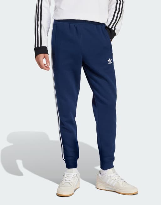 adidas Originals – adicolor – Hose in dunklem Indigoblau mit den 3 Streifen