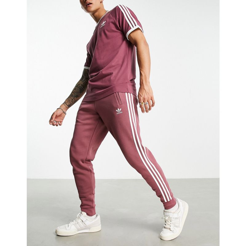 Pantaloni e leggings Uomo adidas Originals - adicolor - Joggers color cremisi tenue con 3 strisce