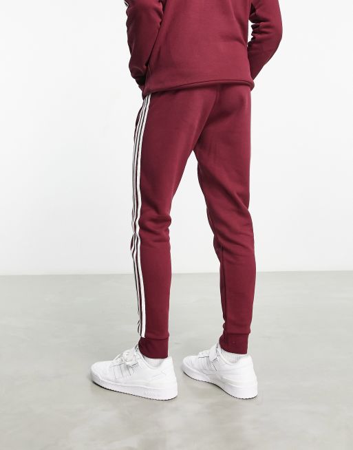 ondersteuning borst taart adidas Originals - adicolor - Joggingbroek met 3-stripes in bordeaux | ASOS