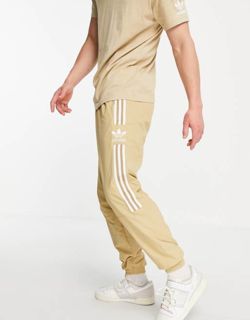 adidas Originals adicolor lock up joggers in beige ASOS