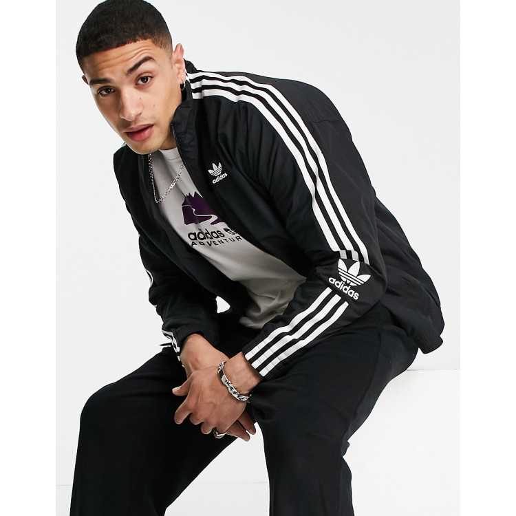 Adidas originals locked up logo track jacket in black on sale