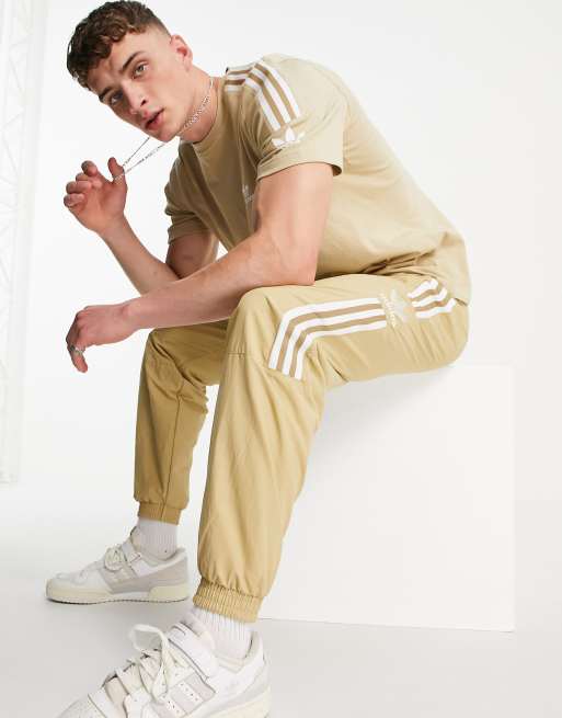 adidas Originals adicolor lock up trackies in beige | ASOS