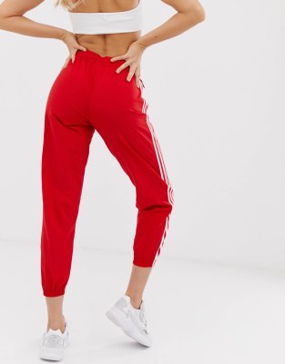 red adidas track pants