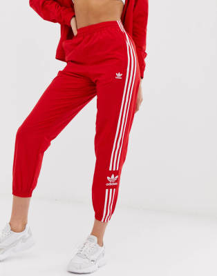 adidas originals adicolor locked up logo track pants in red