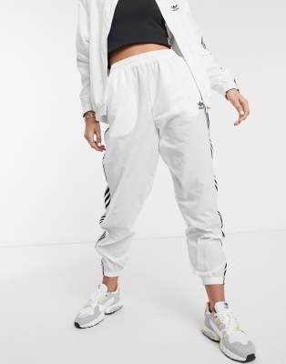 adidas originals adicolor locked up logo track pants in white