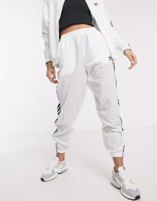 adidas Originals adicolor locked up logo track pants in white ASOS