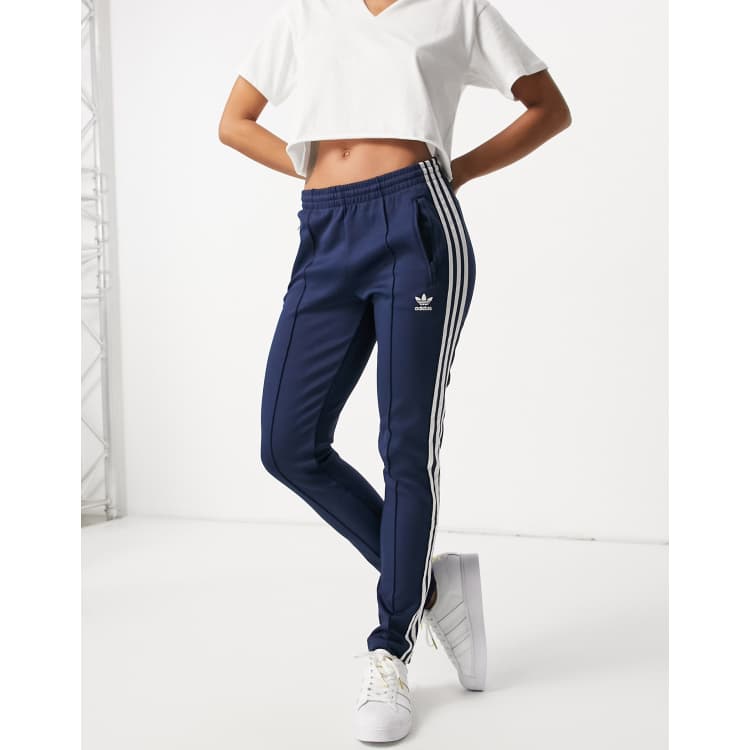 adidas Originals adicolor logo three stripe track pants in navy ASOS