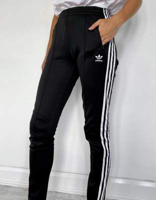 adidas originals adicolor logo track pants in black