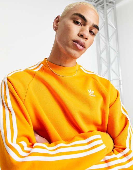 adidas - adicolor - Oranje sweatshirt drie strepen | ASOS