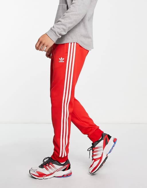 Adidas originals - adicolor - pantalon de survêtement à trois bandes - rouge online