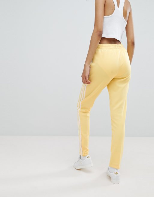 adidas Originals adicolor Pantalon de surv tement trois bandes Jaune