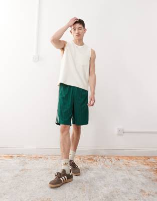 Adicolor poly shorts in collegiate green