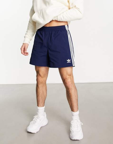 adidas Originals adicolor polyester 3 stripe shorter shorts in navy - view 1