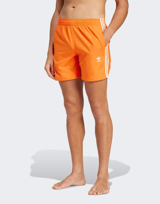 adidas Originals – Adicolor – Pomarańczowe szorty kąpielowe z 3 paskami