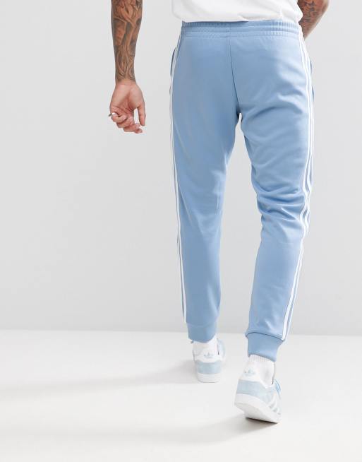 Blue skinny adidas joggers on sale