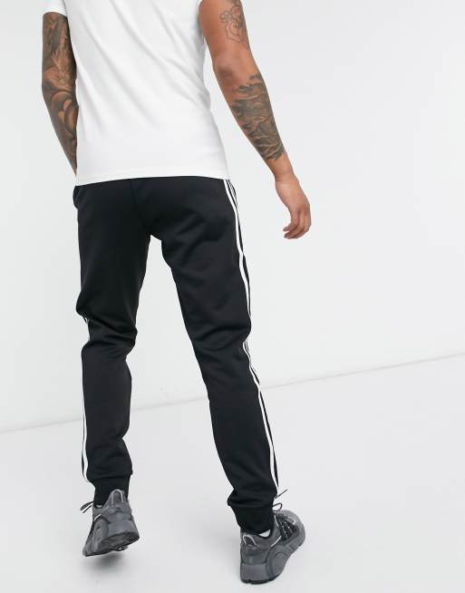 adidas Originals adicolor Skinny joggingbroek met 3 Stripes in zwart ASOS