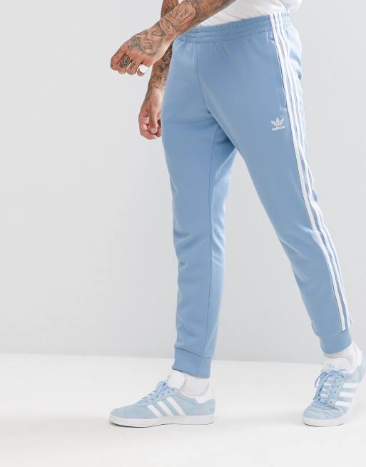 adidas Originals adicolor skinny Sweatpants cuffed hem In Blue CW1277