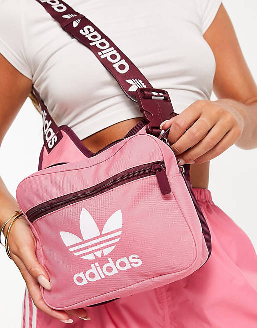 gegevens Herhaald Bloedbad adidas Originals adicolor sling bag in pink with branded strap | ASOS