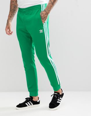 green and orange adidas tracksuit