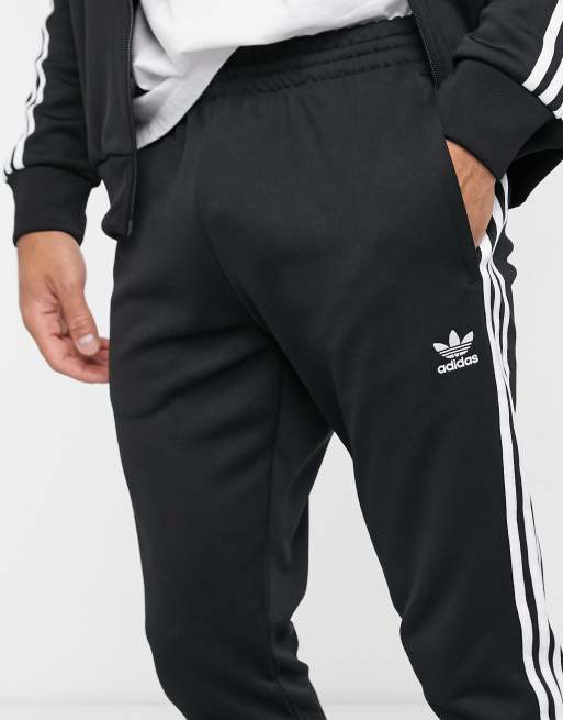 adidas adicolor Superstar three stripe sweatpants in black | ASOS