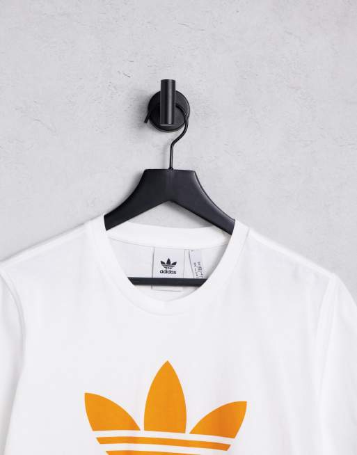 Adidas shirt logo hot sale